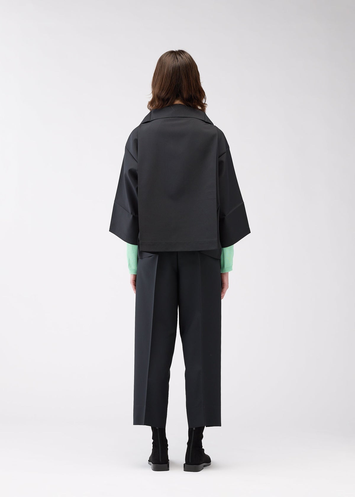 A model wears the 132 5. ISSEY MIYAKE 132 5. FLAT 1 jacket.