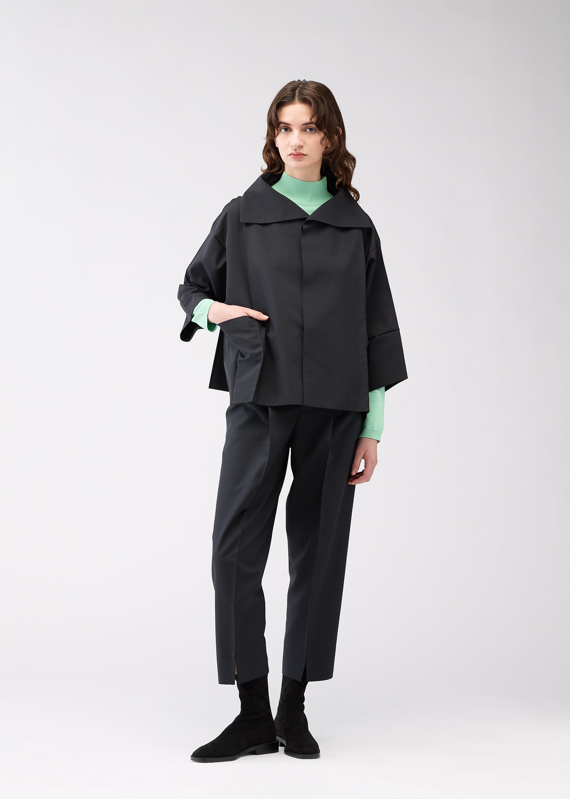 A model wears the 132 5. ISSEY MIYAKE 132 5. FLAT 1 jacket.