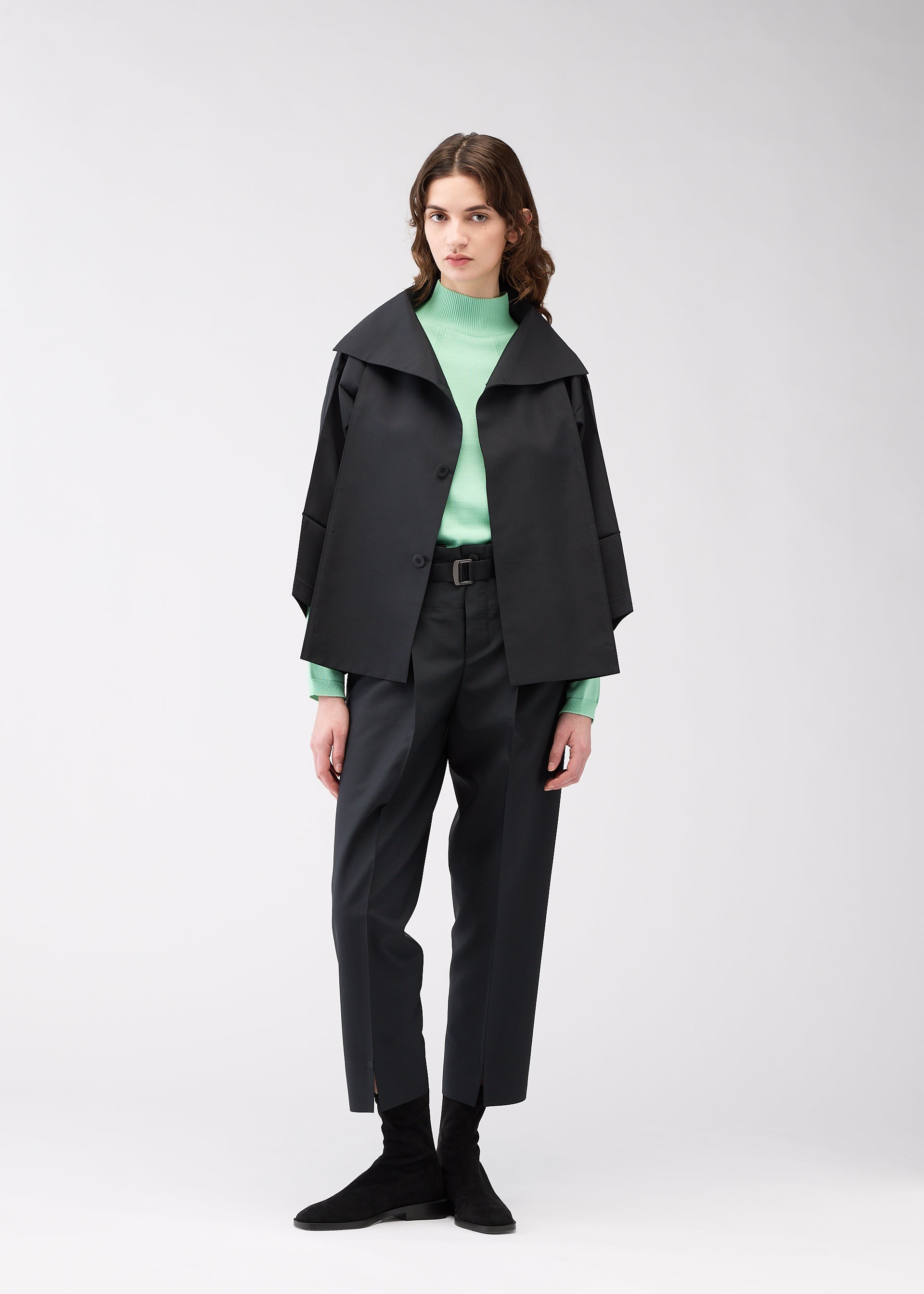 A model wears the 132 5. ISSEY MIYAKE 132 5. FLAT 1 jacket.