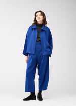 A model wears the 132 5. ISSEY MIYAKE WOOL LIKE FLAT TUCK jacket.