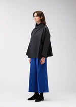 A model wears the 132 5. ISSEY MIYAKE 132 5. FLAT 2 clothing.