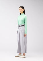A model wears the 132 5. ISSEY MIYAKE FLAT SQUARE BOTTOMS trousers.