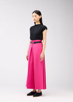 A model wears the 132 5. ISSEY MIYAKE FLAT SQUARE BOTTOMS trousers.