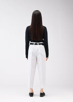 A model wears the 132 5. ISSEY MIYAKE 132 5. FLAT 1 trousers.
