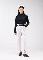 A model wears the 132 5. ISSEY MIYAKE 132 5. FLAT 1 trousers.