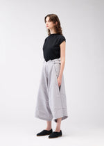 A model wears the 132 5. ISSEY MIYAKE NO.2 trousers.