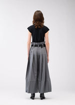 A model wears the 132 5. ISSEY MIYAKE NO.3 trousers.
