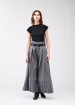 A model wears the 132 5. ISSEY MIYAKE NO.3 trousers.