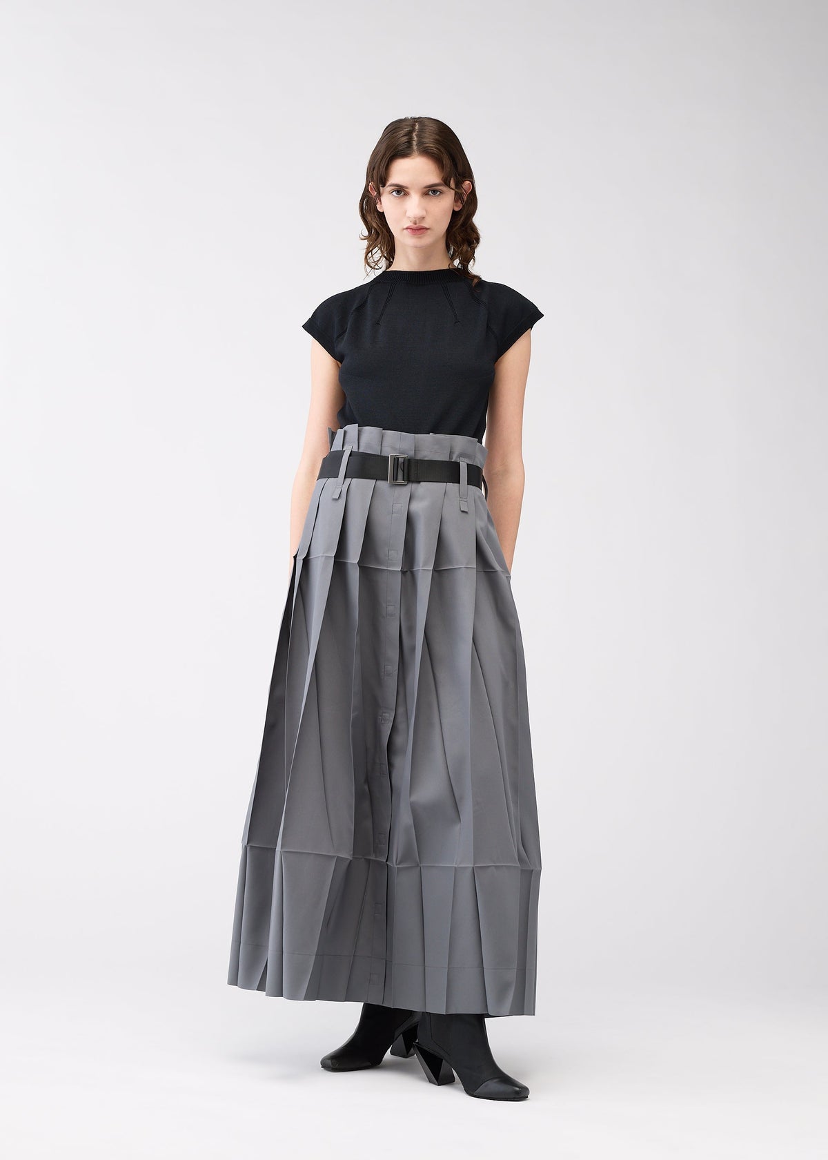 A model wears the 132 5. ISSEY MIYAKE NO.3 trousers.