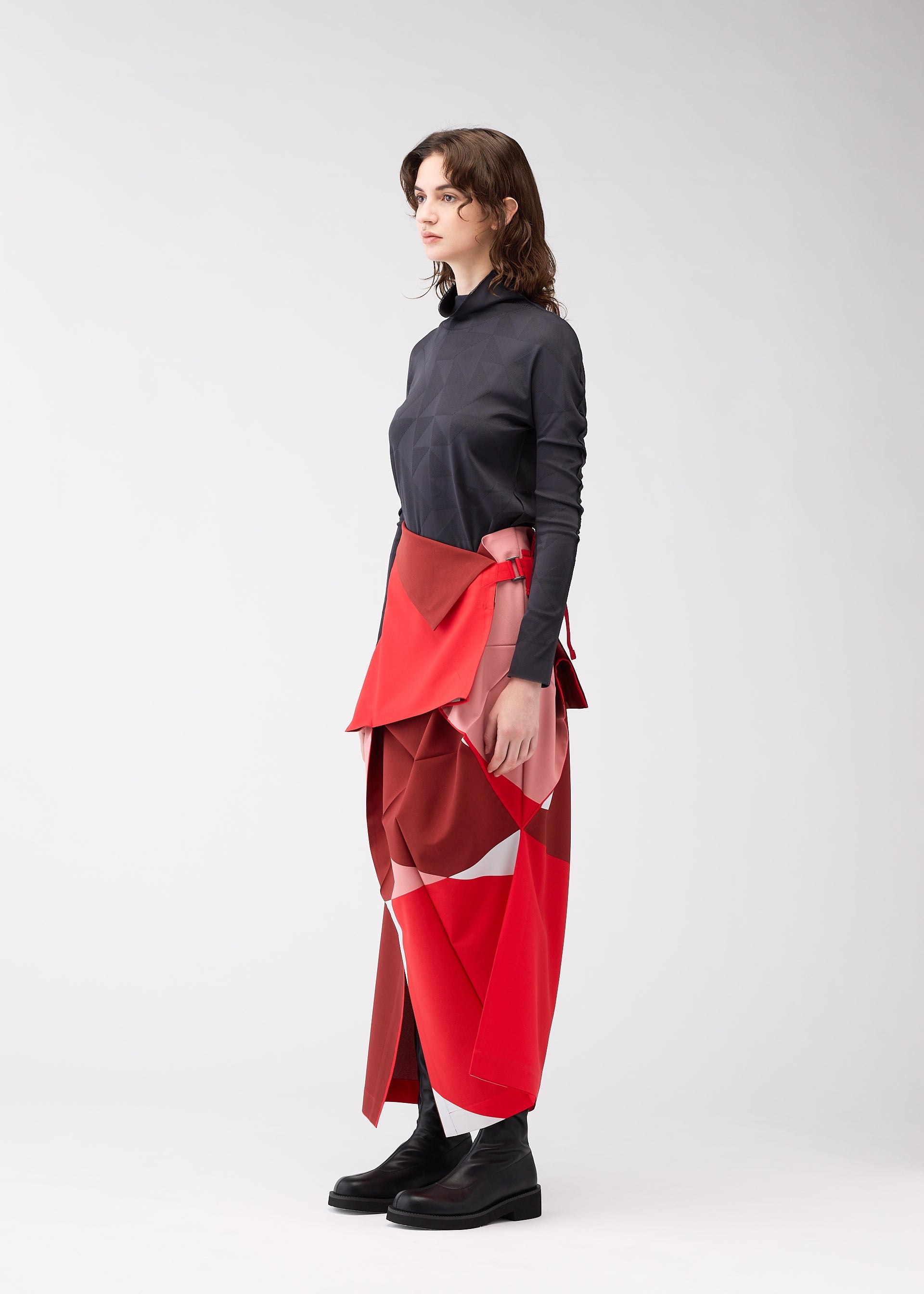 A model wears the 132 5. ISSEY MIYAKE POSITIONS skirt.