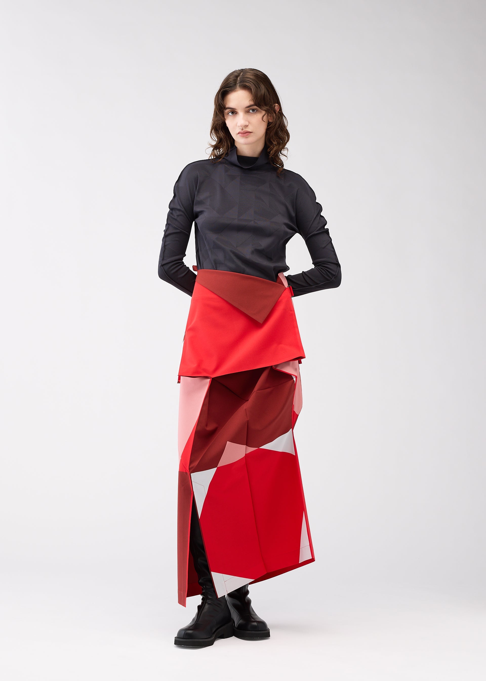 A model wears the 132 5. ISSEY MIYAKE POSITIONS skirt.