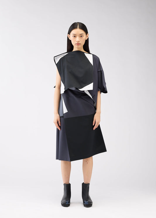 A model wears the 132 5. ISSEY MIYAKE POSITIONS dress.