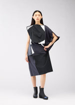 A model wears the 132 5. ISSEY MIYAKE POSITIONS dress.