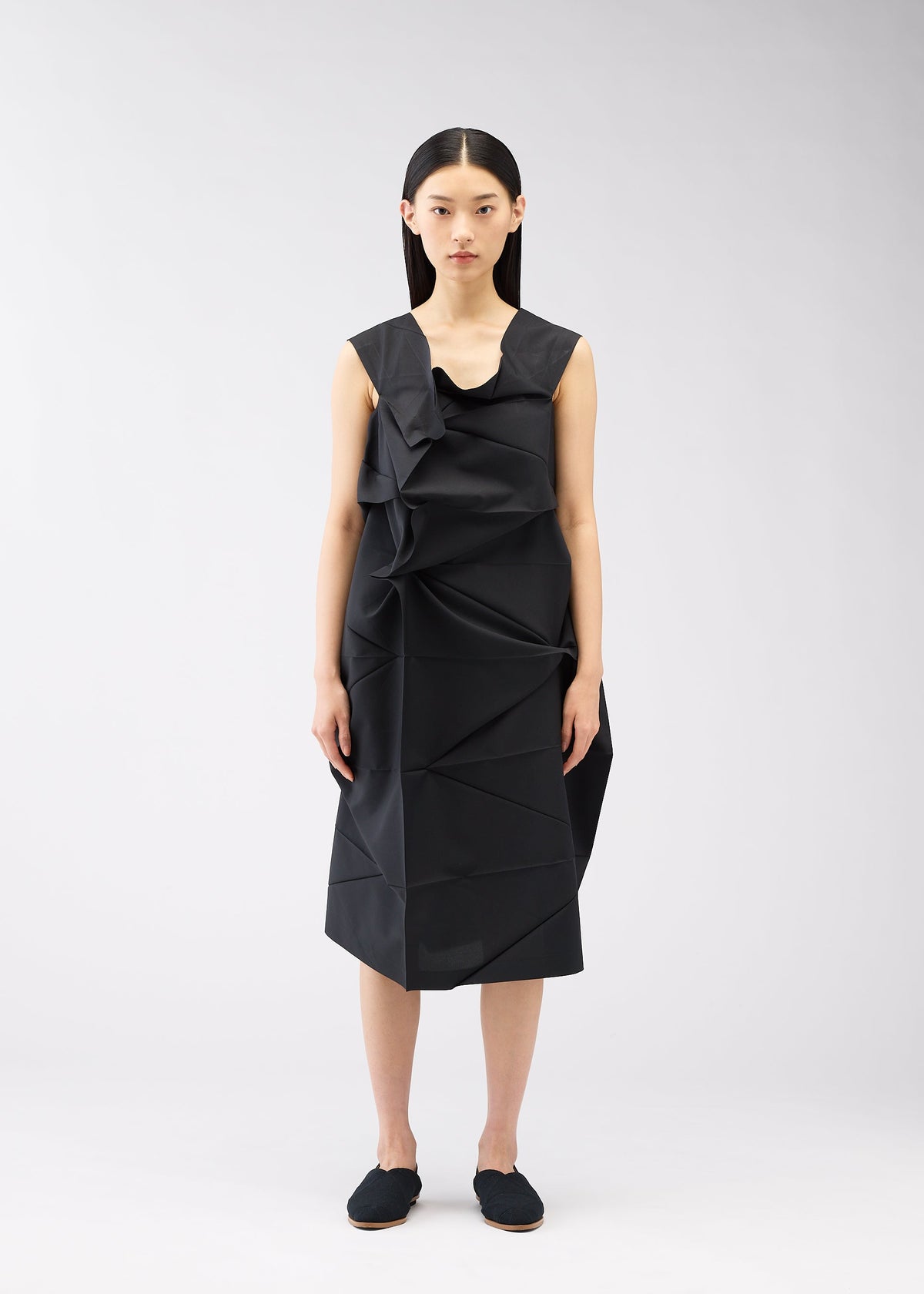 A model wears the 132 5. ISSEY MIYAKE NO.2 dress.