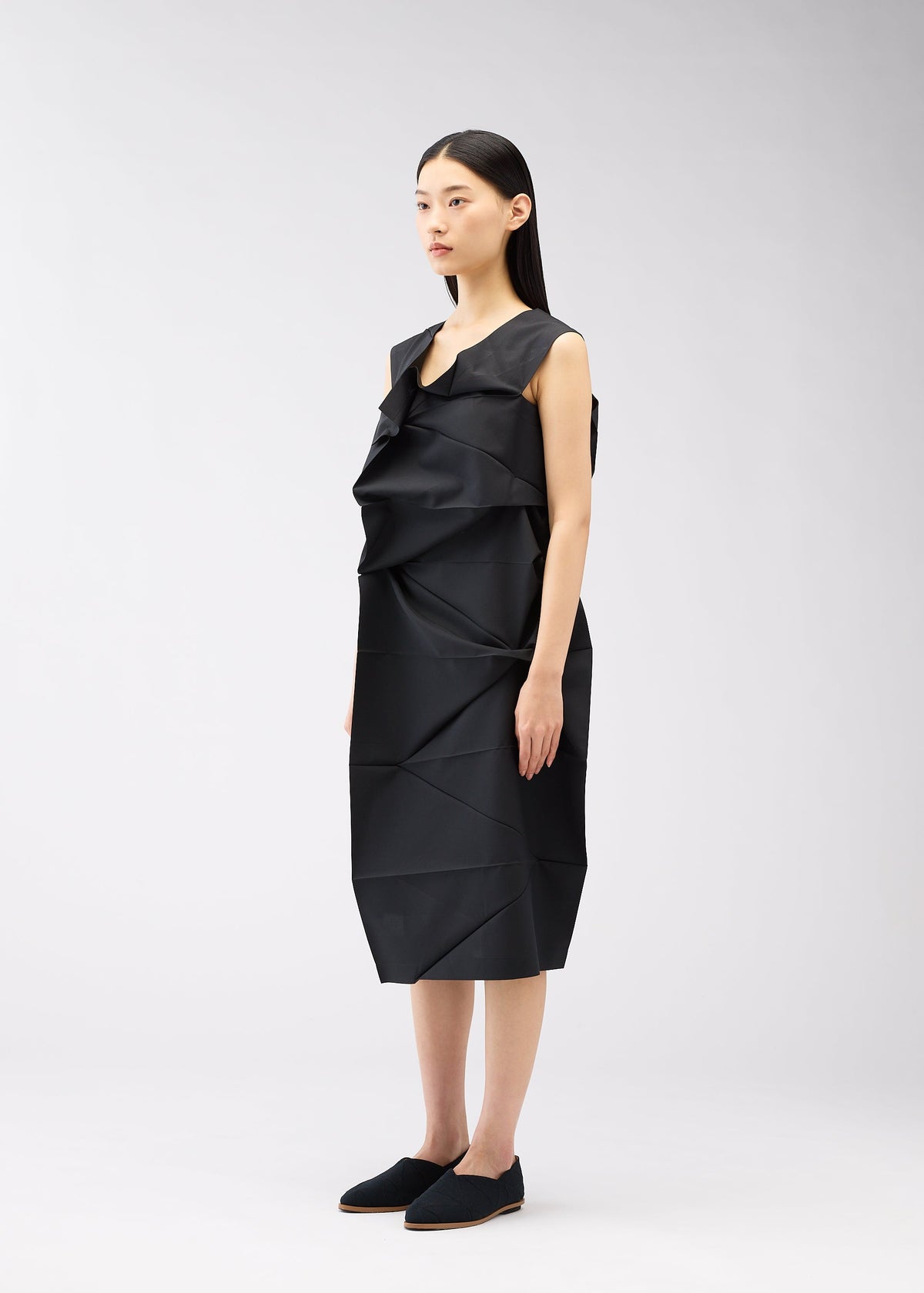 A model wears the 132 5. ISSEY MIYAKE NO.2 dress.