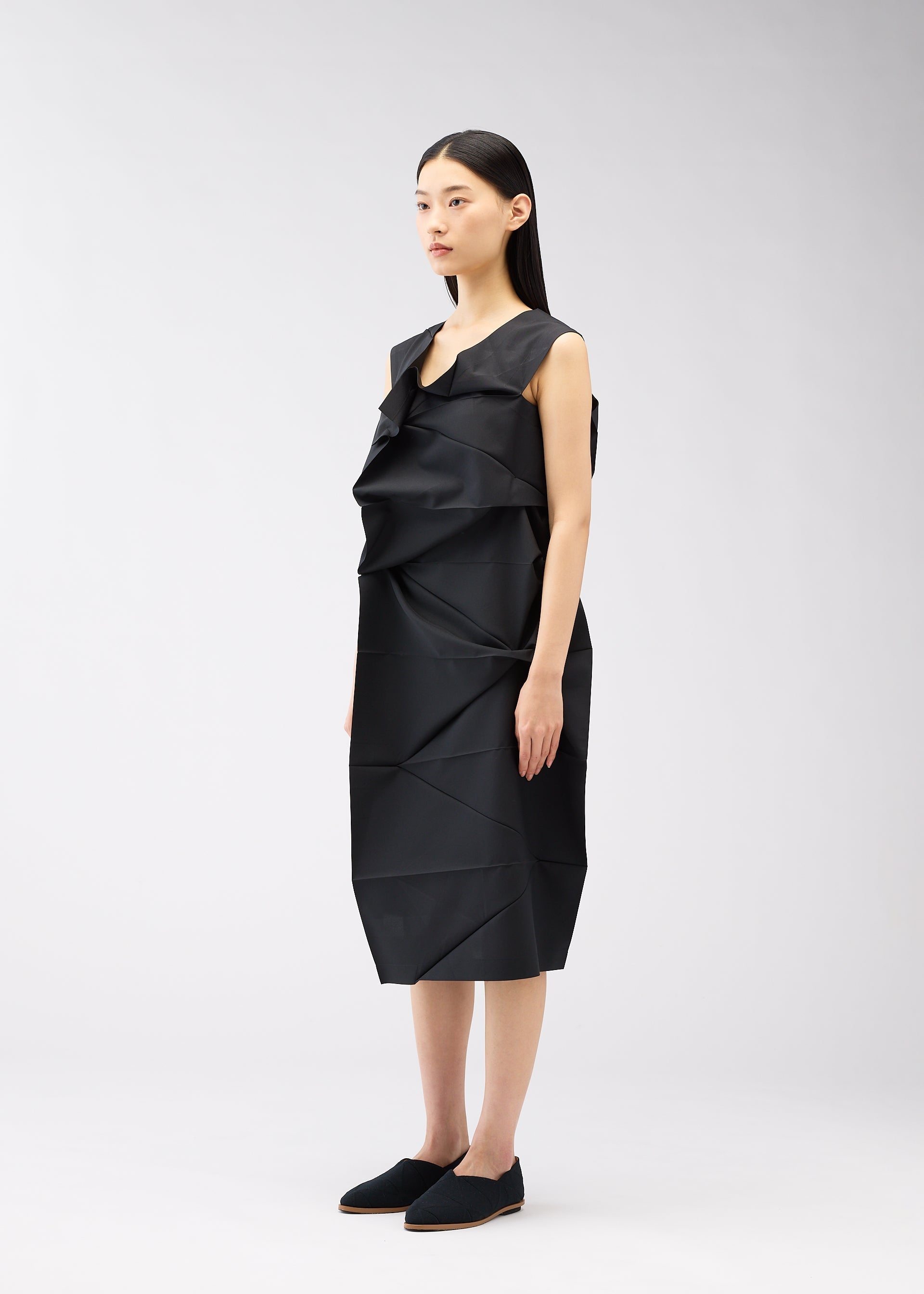 A model wears the 132 5. ISSEY MIYAKE NO.2 dress.