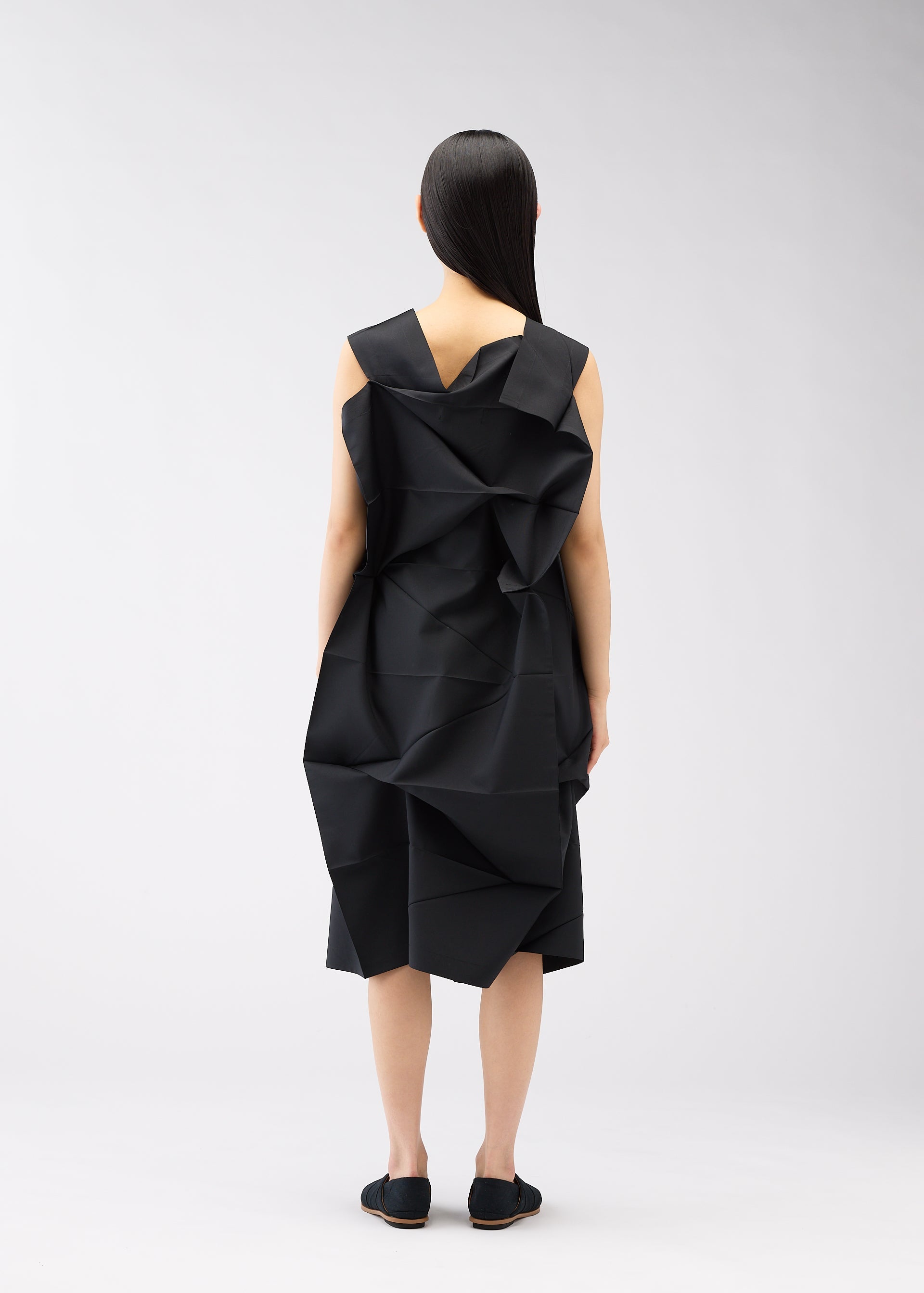 A model wears the 132 5. ISSEY MIYAKE NO.2 dress.