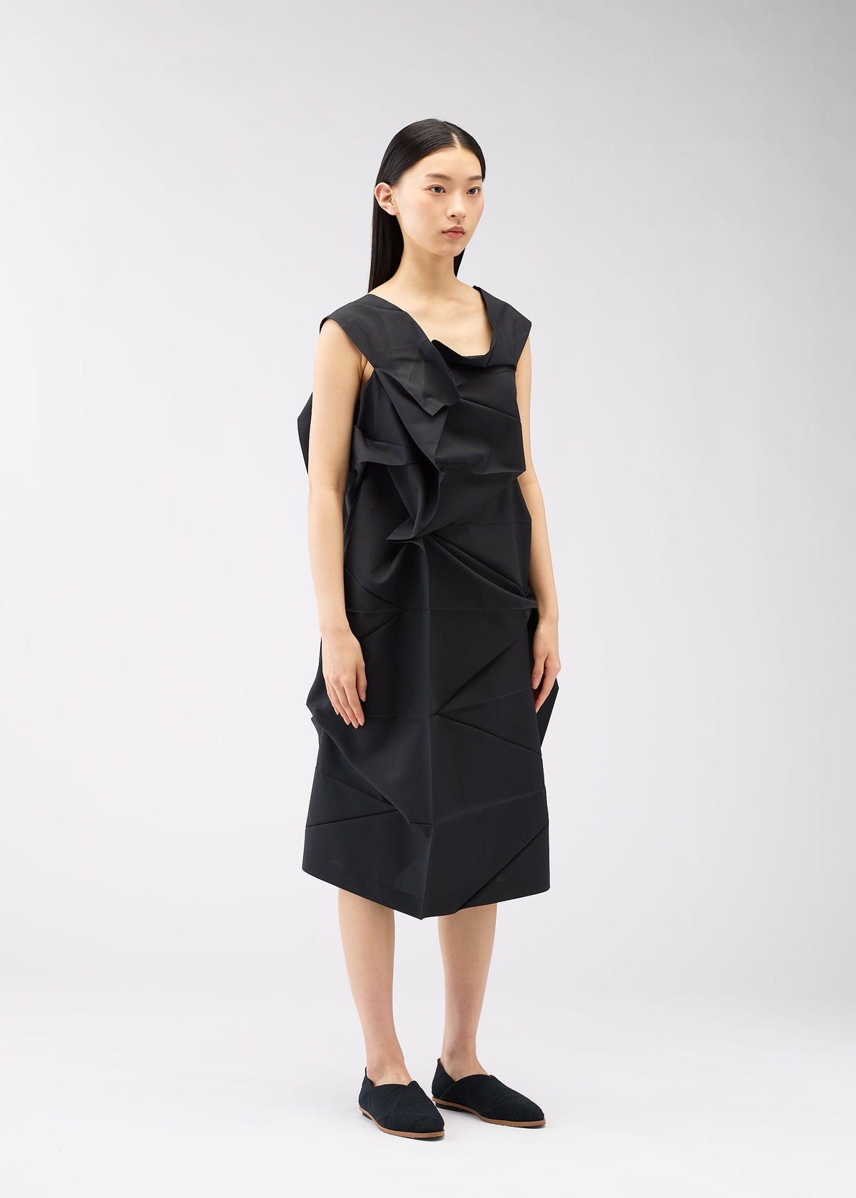 A model wears the 132 5. ISSEY MIYAKE NO.2 dress.