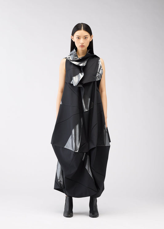A model wears the 132 5. ISSEY MIYAKE NO.16 FOIL dress.