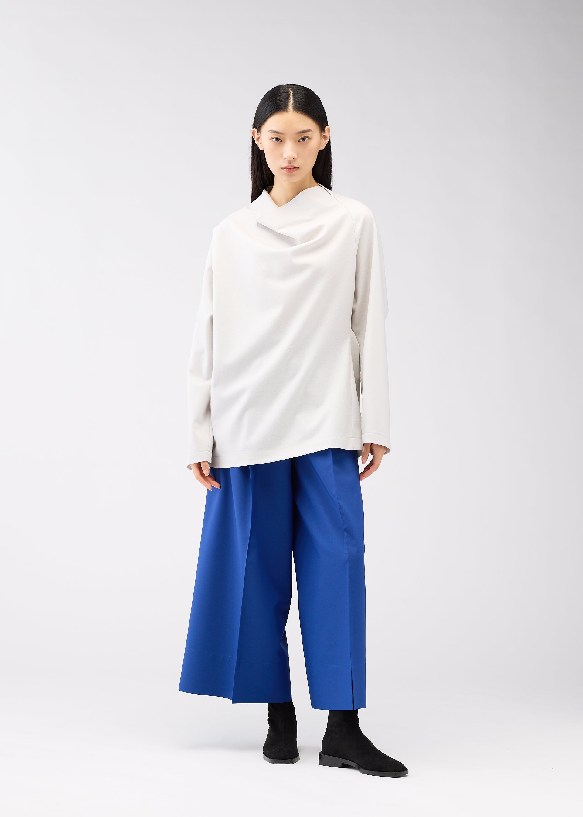 A model wears the 132 5. ISSEY MIYAKE CLEANCUT WOOL clothing.