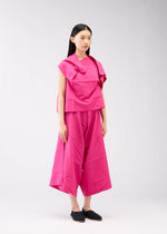 A model wears the 132 5. ISSEY MIYAKE NO.2 shirt.