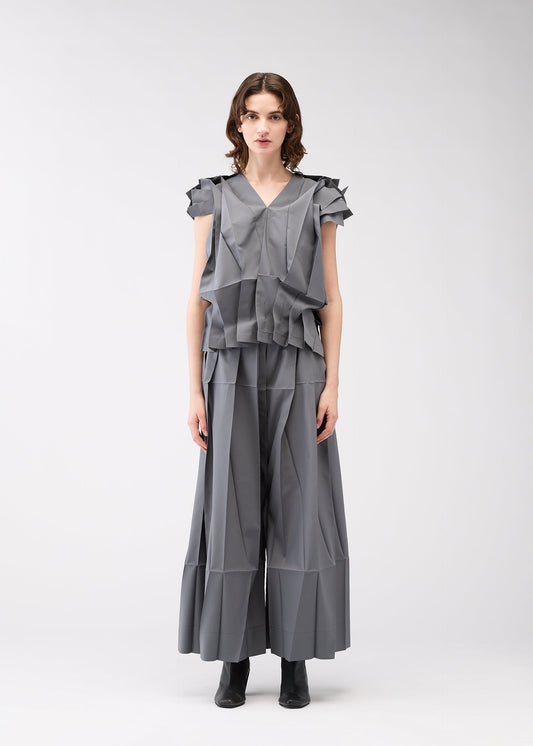 A model wears the 132 5. ISSEY MIYAKE NO.3 shirt.
