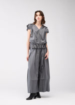 A model wears the 132 5. ISSEY MIYAKE NO.3 shirt.