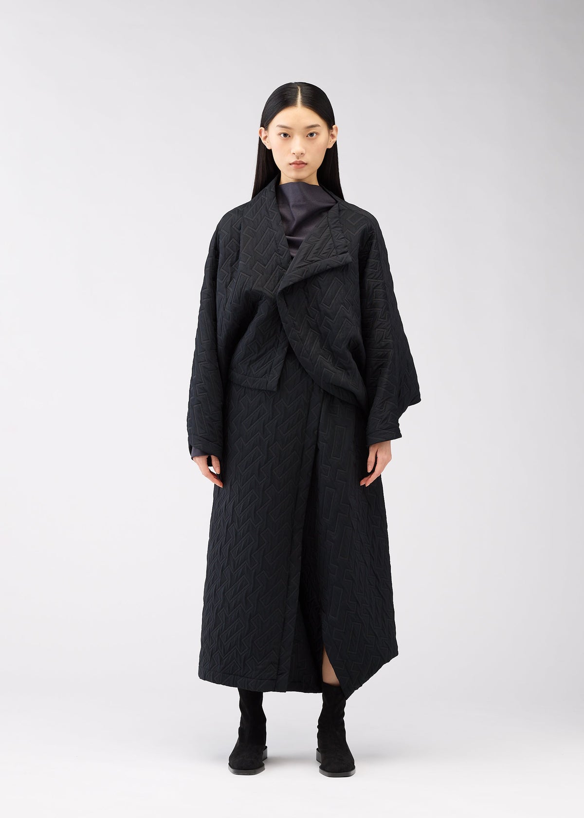 A model wears the 132 5. ISSEY MIYAKE ONE CLOTH PUFF clothing.