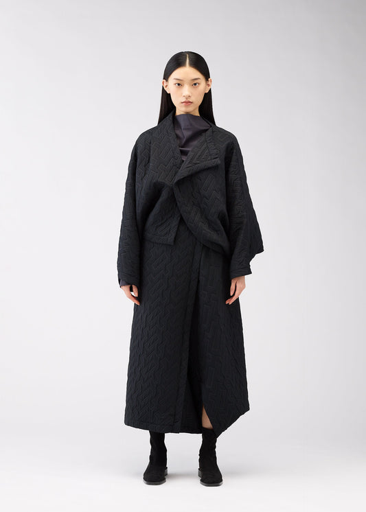 A model wears the 132 5. ISSEY MIYAKE ONE CLOTH PUFF clothing.