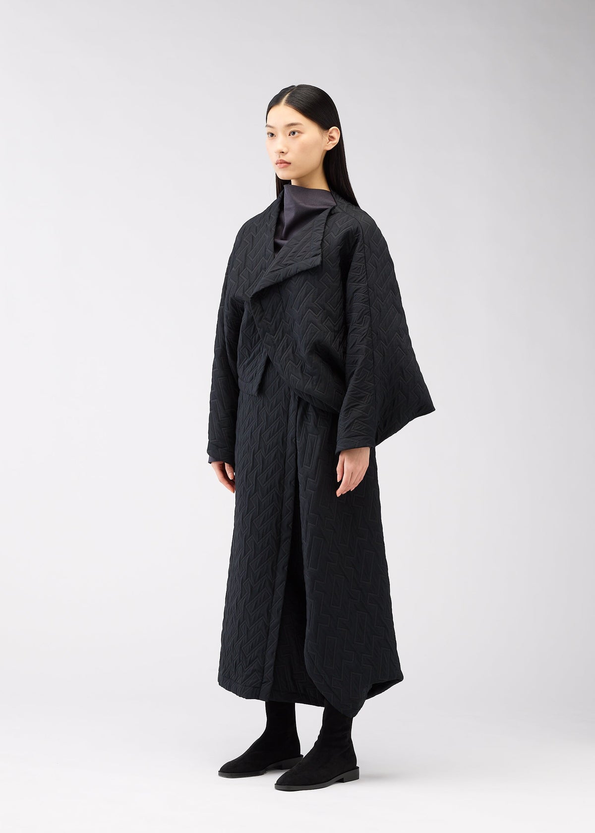 A model wears the 132 5. ISSEY MIYAKE ONE CLOTH PUFF clothing.