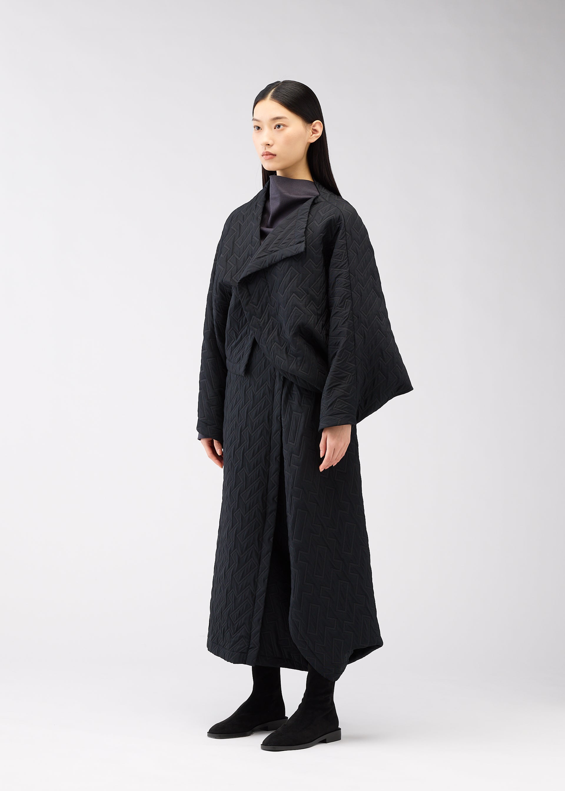 A model wears the 132 5. ISSEY MIYAKE ONE CLOTH PUFF clothing.