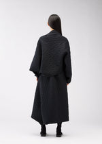 A model wears the 132 5. ISSEY MIYAKE ONE CLOTH PUFF clothing.