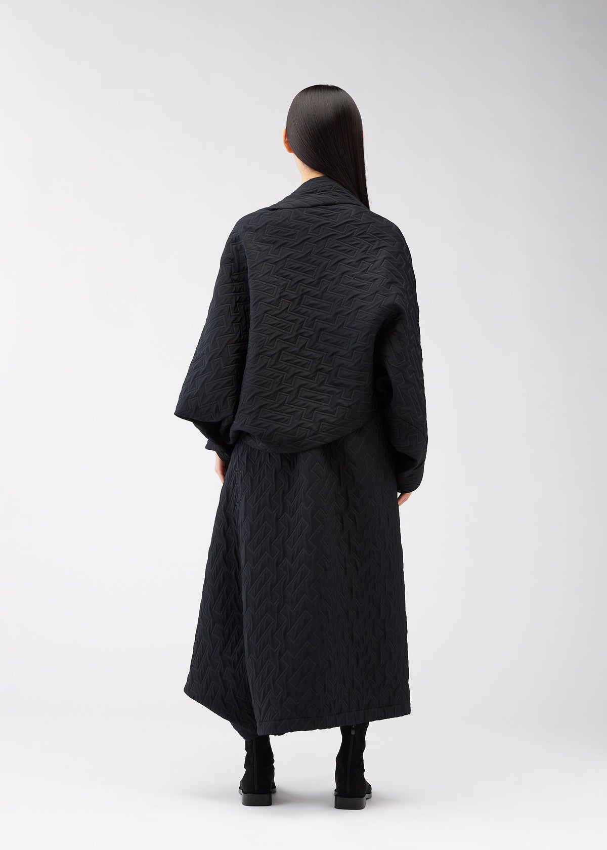 A model wears the 132 5. ISSEY MIYAKE ONE CLOTH PUFF clothing.