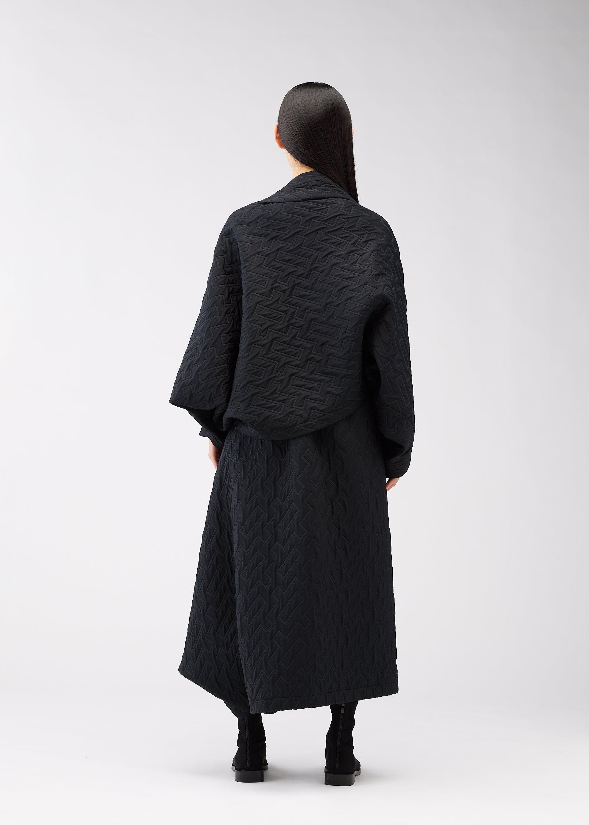 A model wears the 132 5. ISSEY MIYAKE ONE CLOTH PUFF clothing.