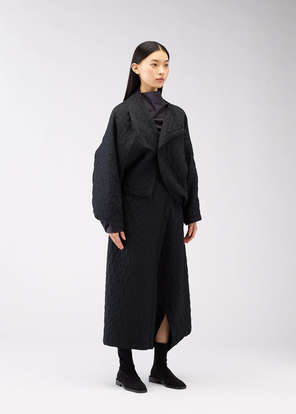 A model wears the 132 5. ISSEY MIYAKE ONE CLOTH PUFF clothing.