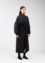 A model wears the 132 5. ISSEY MIYAKE ONE CLOTH PUFF clothing.