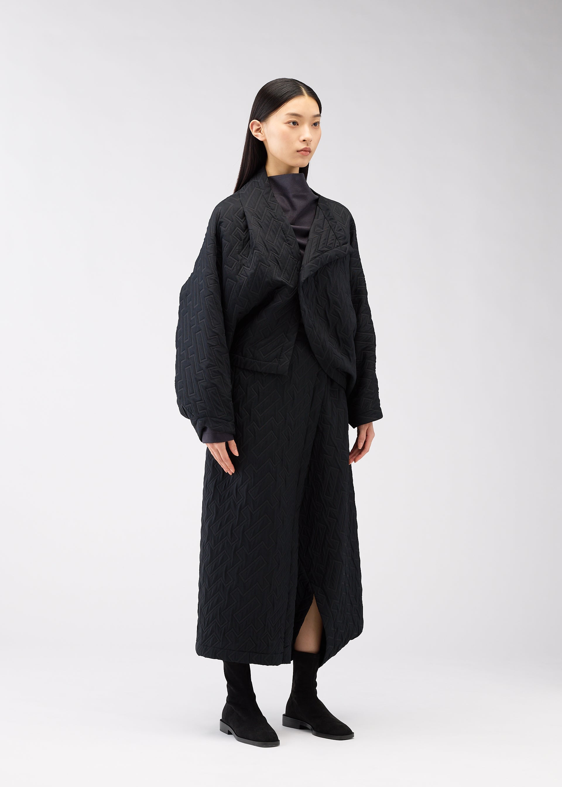 A model wears the 132 5. ISSEY MIYAKE ONE CLOTH PUFF clothing.