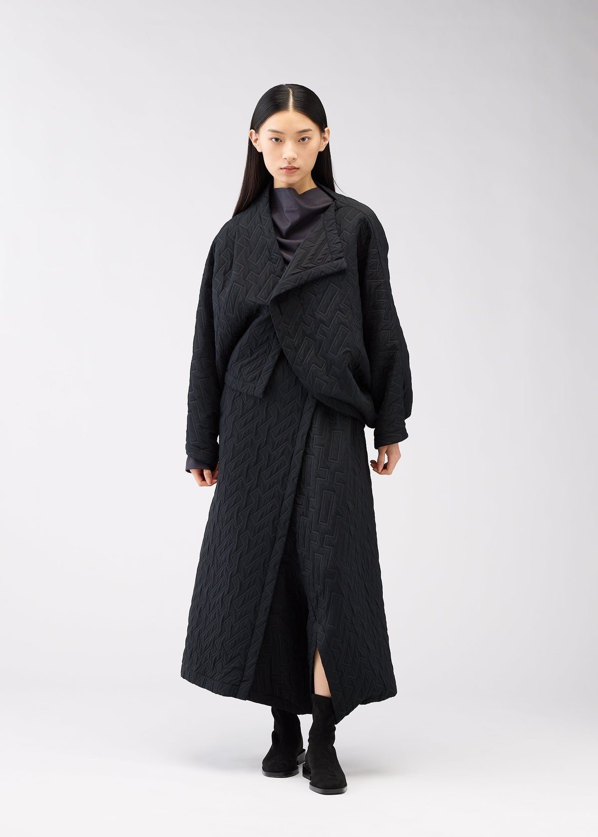 A model wears the 132 5. ISSEY MIYAKE ONE CLOTH PUFF clothing.