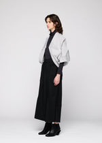 A model wears the 132 5. ISSEY MIYAKE NO.16 FOIL cardigan.