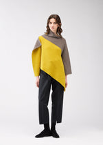 A model wears the 132 5. ISSEY MIYAKE POSITIONED KNIT top.