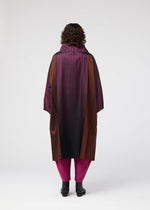 A model wears the 132 5. ISSEY MIYAKE GRADATION COAT clothing.