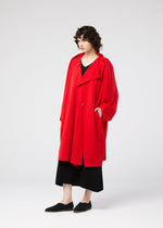 A model wears the 132 5. ISSEY MIYAKE PARALLEL WRAP coat.