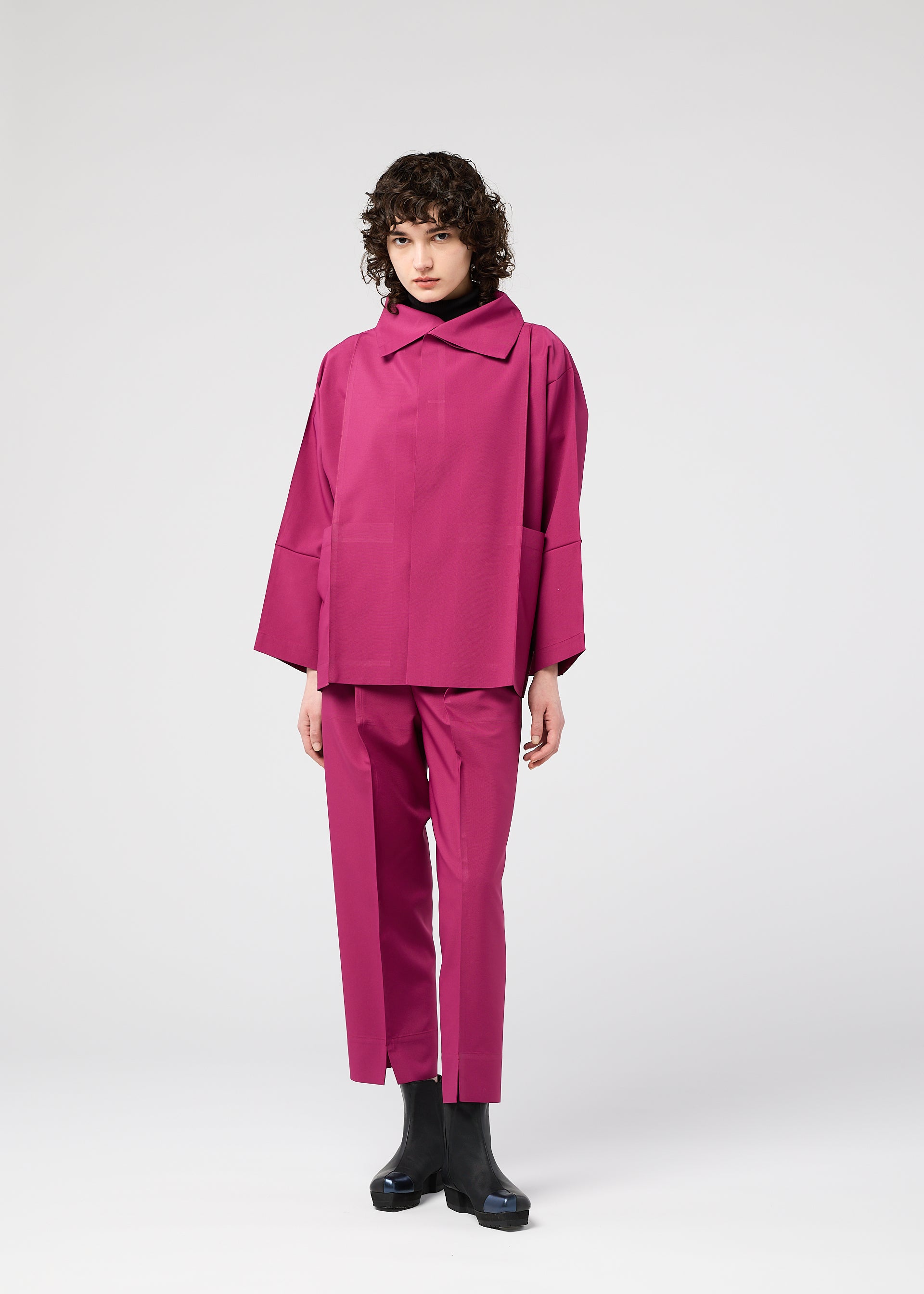 A model wears the 132 5. ISSEY MIYAKE 132 5. FLAT 1 jacket.