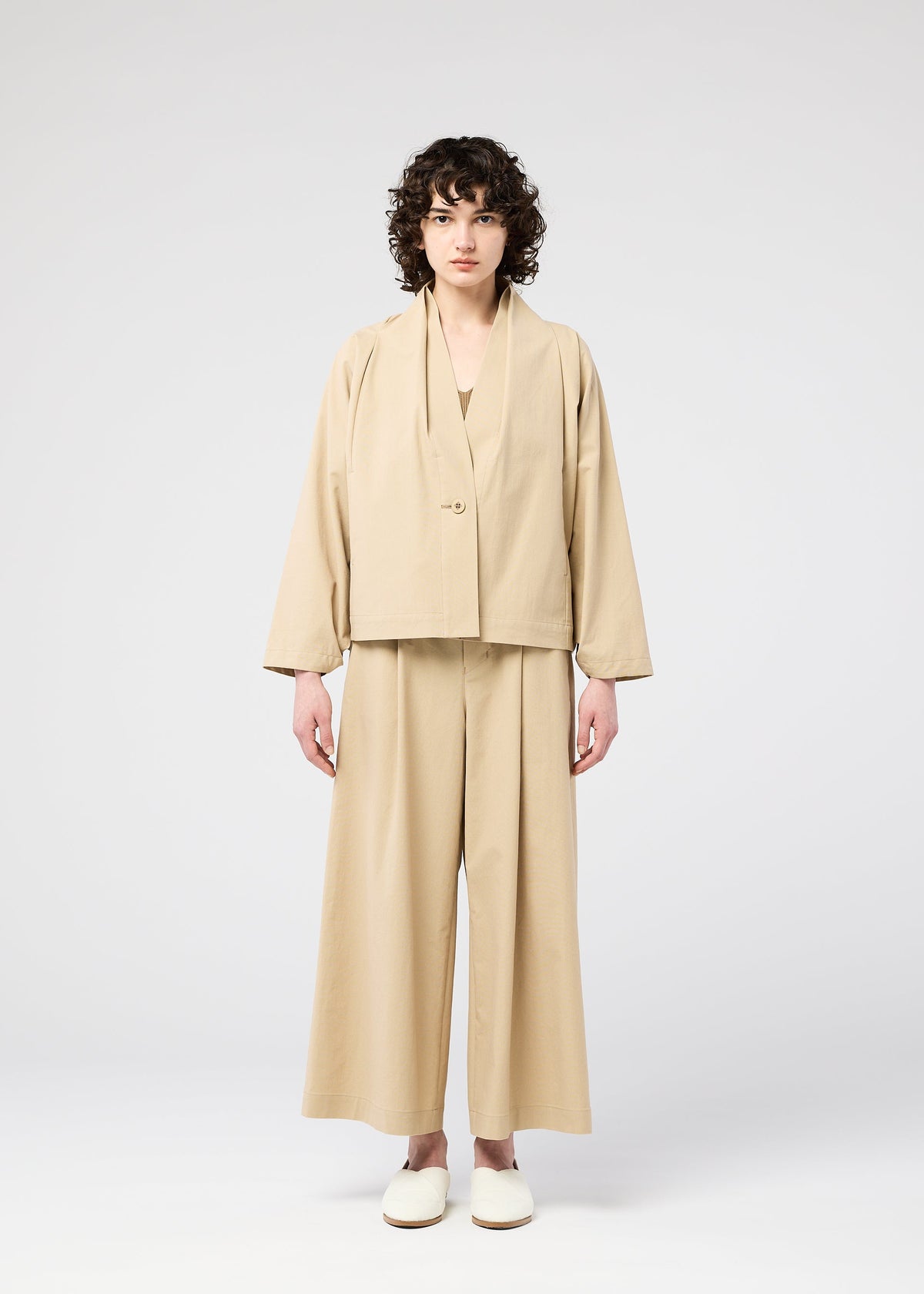 A model wears the 132 5. ISSEY MIYAKE WASHI STRETCH jacket.