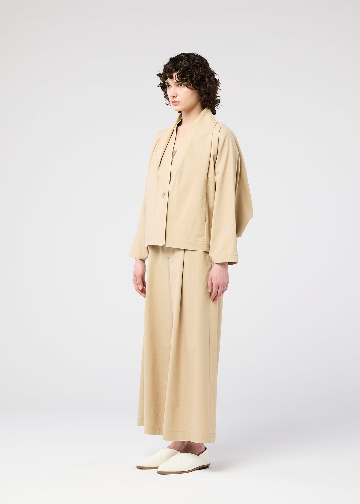 A model wears the 132 5. ISSEY MIYAKE WASHI STRETCH jacket.