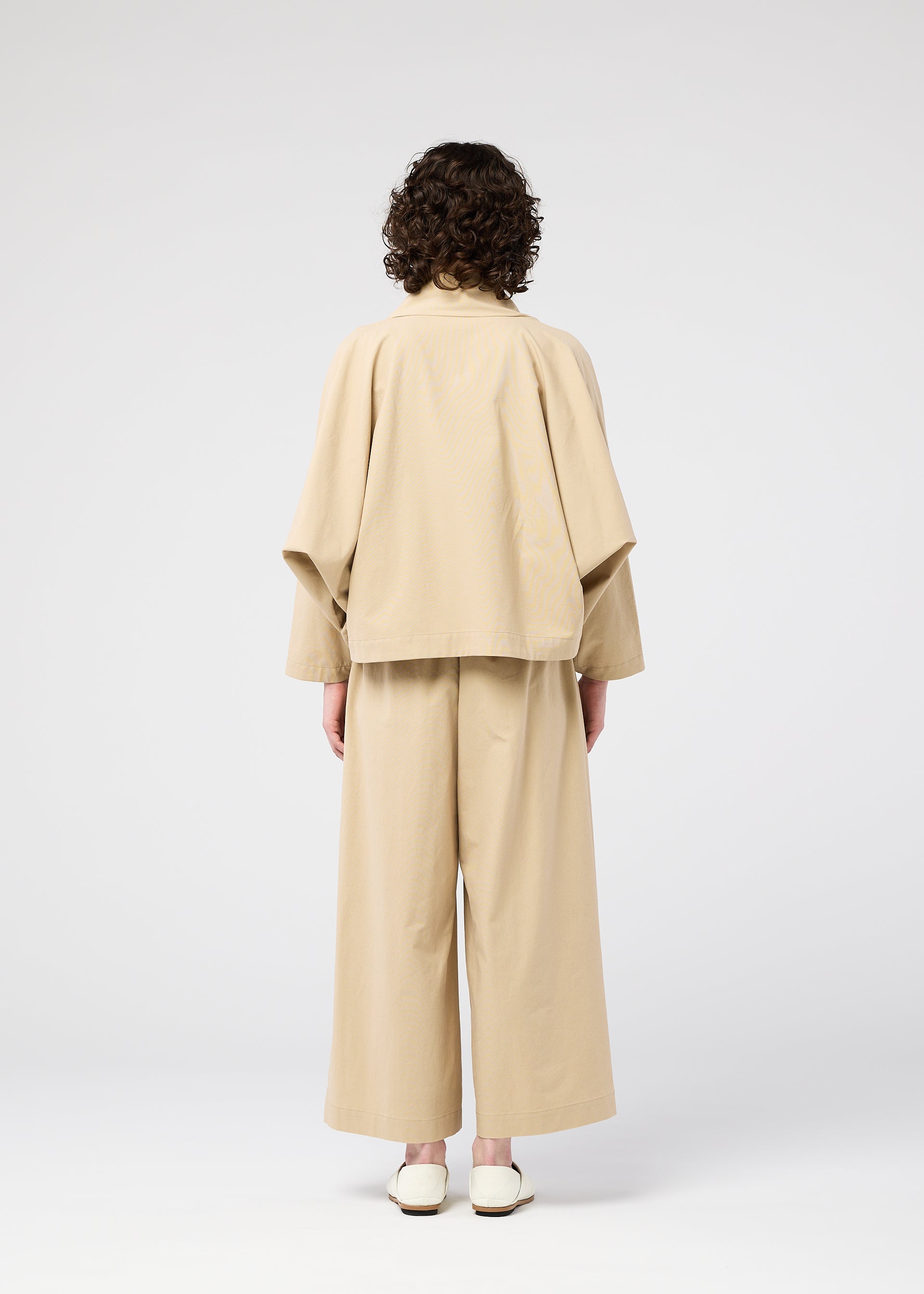 A model wears the 132 5. ISSEY MIYAKE WASHI STRETCH jacket.