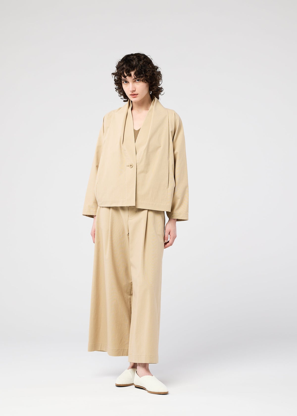 A model wears the 132 5. ISSEY MIYAKE WASHI STRETCH jacket.