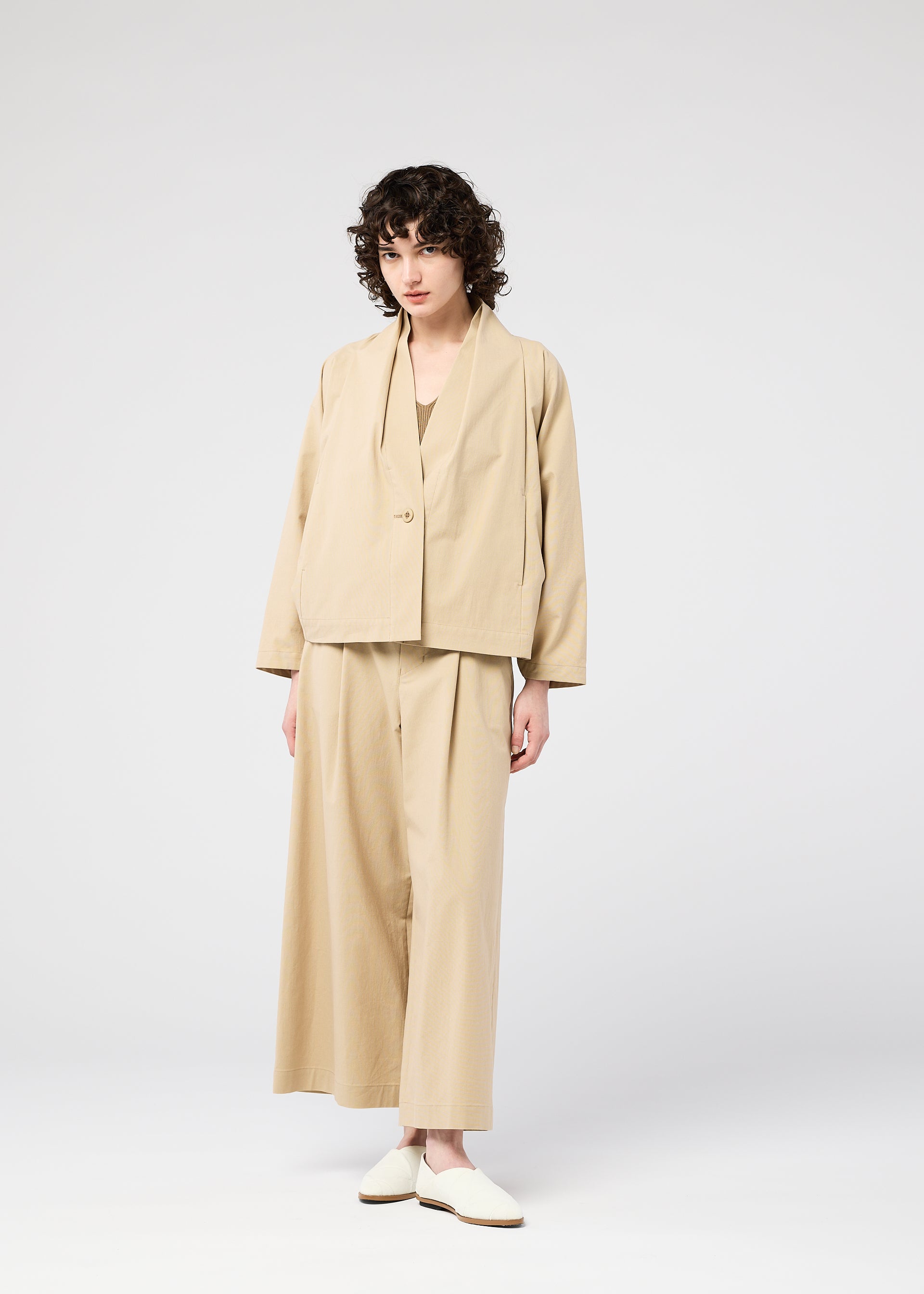 A model wears the 132 5. ISSEY MIYAKE WASHI STRETCH jacket.