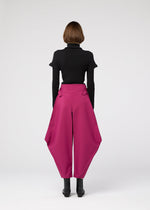 A model wears the 132 5. ISSEY MIYAKE VERTEX BOTTOMS clothing.