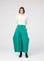 A model wears the 132 5. ISSEY MIYAKE VERTEX BOTTOMS clothing.